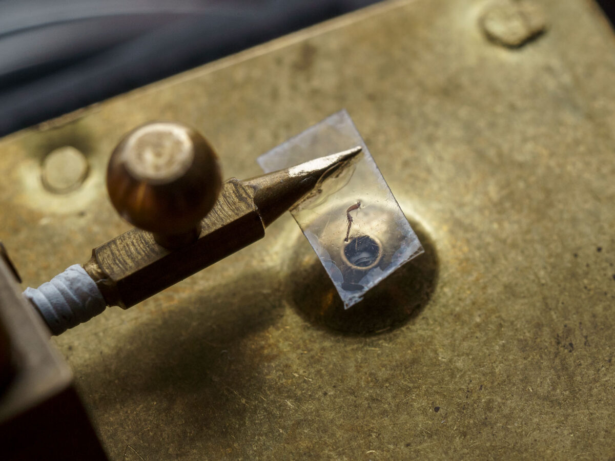 flea leg on a flake of mica on a replica Leeuwenhoek microscope
